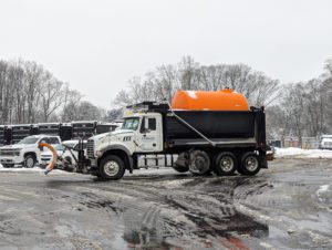 Dump Truck providing snow removal and salting services