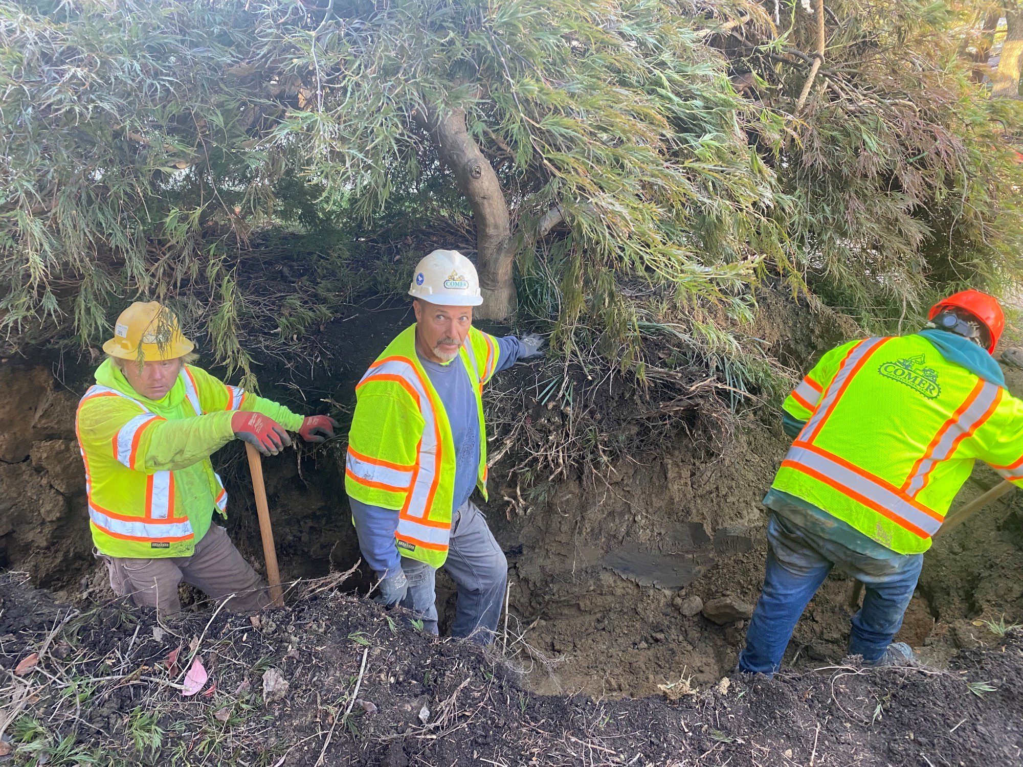 Dennis and teammates on a job site.