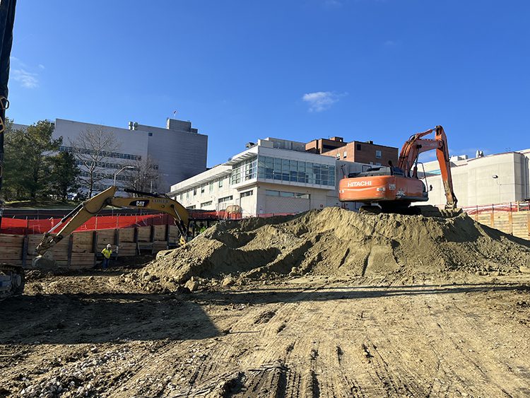 Excavators digging near the hospital preparing for expansion