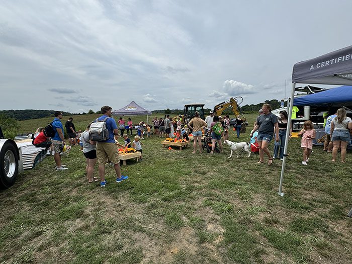 crowd outside comer tent at touch a truck event