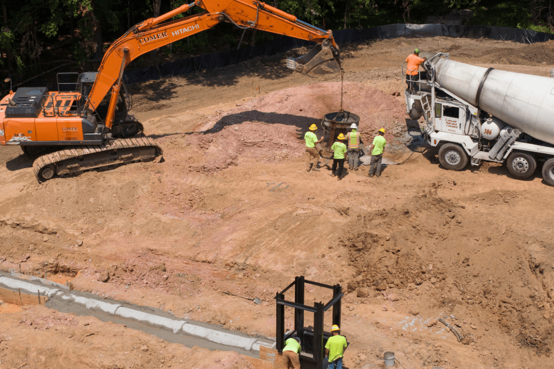 Construction crews working on installation of underground utilities